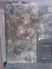 Stone fireplace with smoke damage.